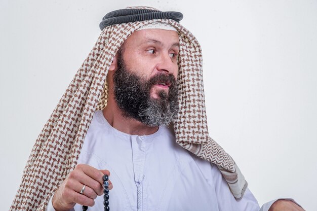 Emotional arabic man posing on white background.