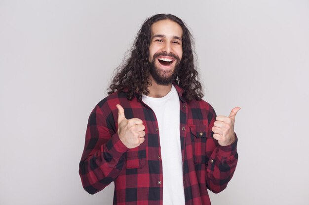 Emotional bearded man on gray background