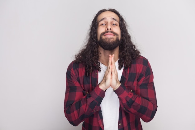 Emotional bearded man on gray background