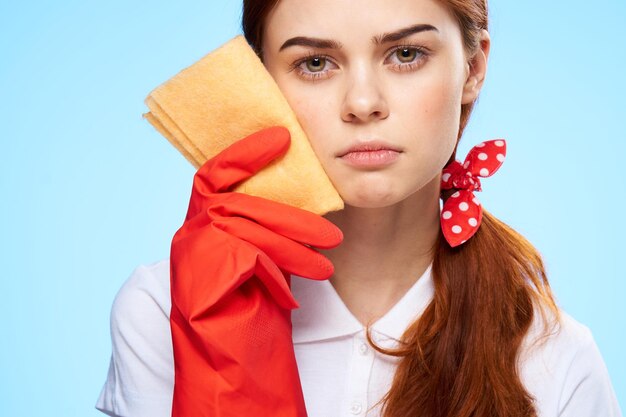 Emotional cleaning lady with a rag in her hands rubber gloves closeup