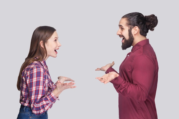 Emotional couple on gray background