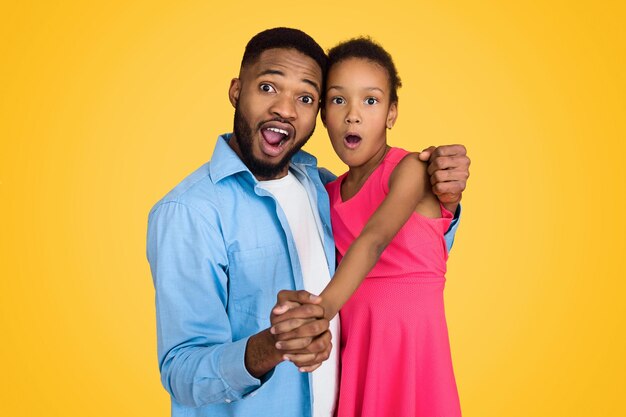 Emotional father and daughter having fun on background