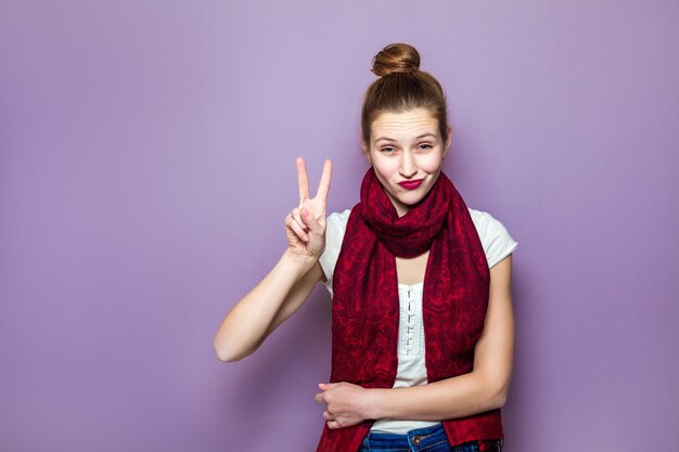 Emotional girl posing on purple background