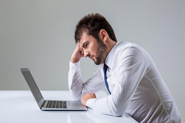 Emotional man and laptop