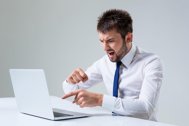 Emotional man and laptop