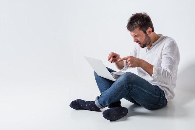 Emotional man and notebook