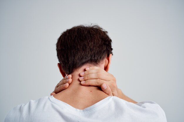 Emotional man pain in the neck health problems massage therapy
isolated background