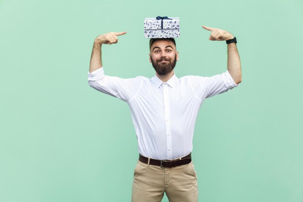 Emotional man in white shirt near green background