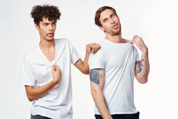 Emotional men in white tshirts antics fun isolated background