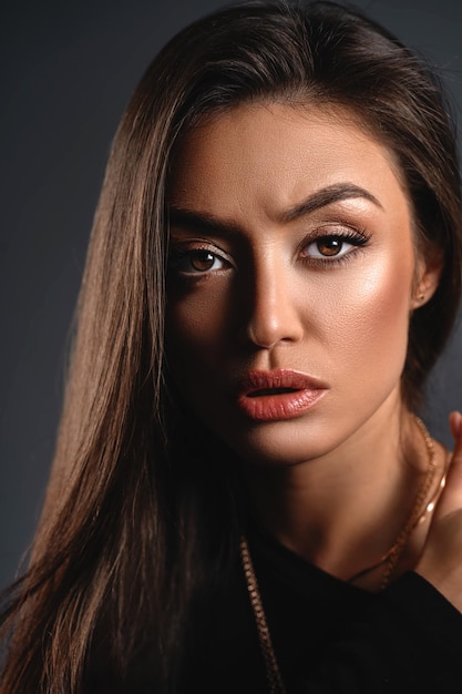 Emotional portrait of an amazed angry surprised girl with raised eyebrows