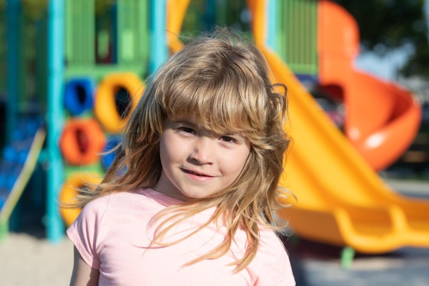 Emotional portrait of a child in the playground outdoor kids activity children playground in urban p