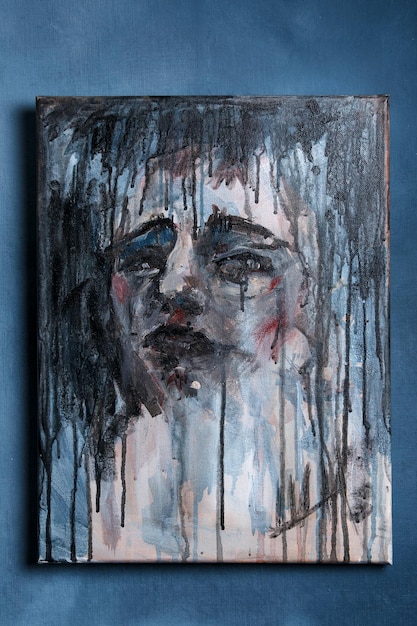 Emotional portrait of a person painting on canvas