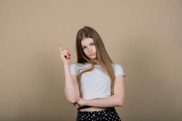 Emotional portrait of surprised woman. Amazement emotion. Studio isolated shooting.