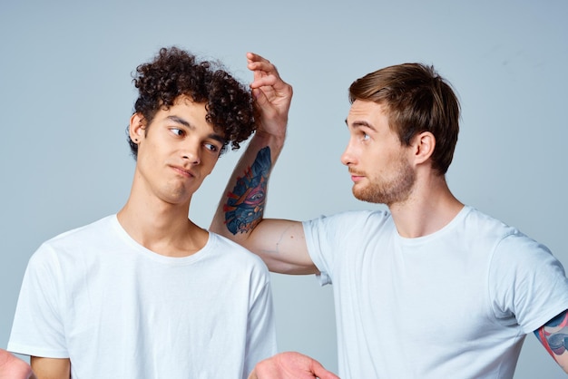 Emotional two friends in white tshirts yes fun studio