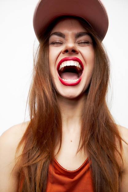 Emotional woman in a cap Emotions fun laugh closed eyes evening makeup