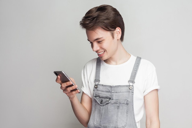 Emotional young man on gray background