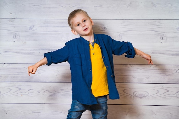 Emotions of the child Cute little boy posing in the studio