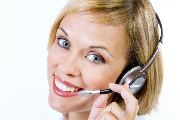 Employee of a call-center smiling at camera