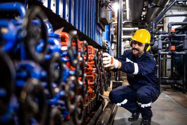 Employee closing valves and hardworking in water factory