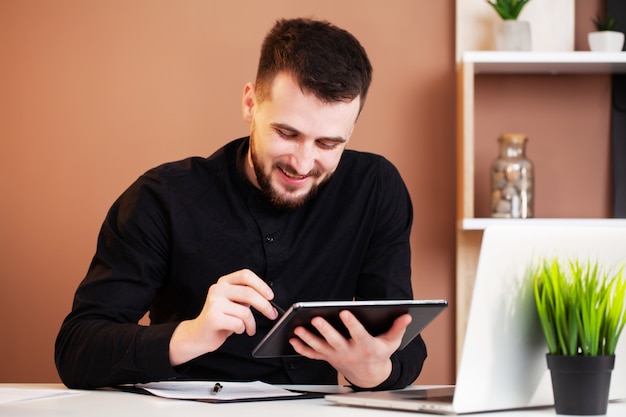 Employee works at the computer in office