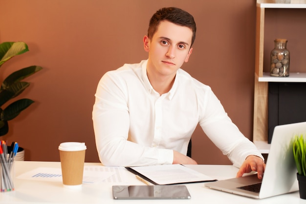 Employee works at the computer in the office