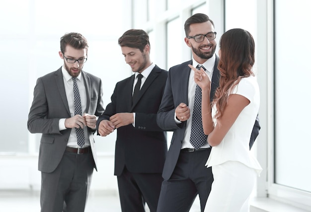 Employees of the company standing in the office lobbyoffice weekdays