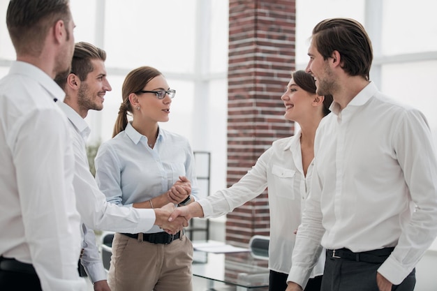 Employees of the company standing in the officeoffice weekdays