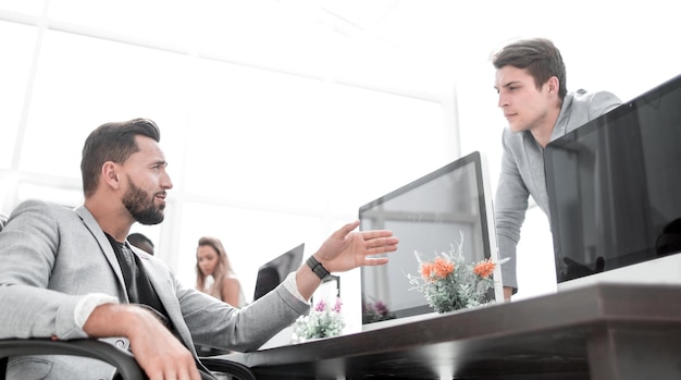 Employees discuss information in the computer room