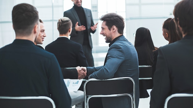 Employees discussing financial issues at a workshop