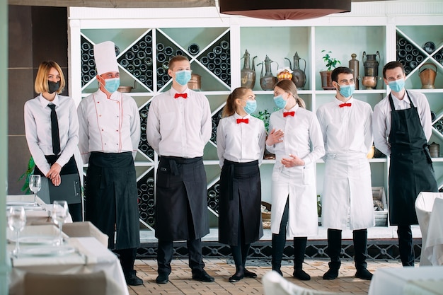 Employees of a Restaurant or Hotel in protective masks