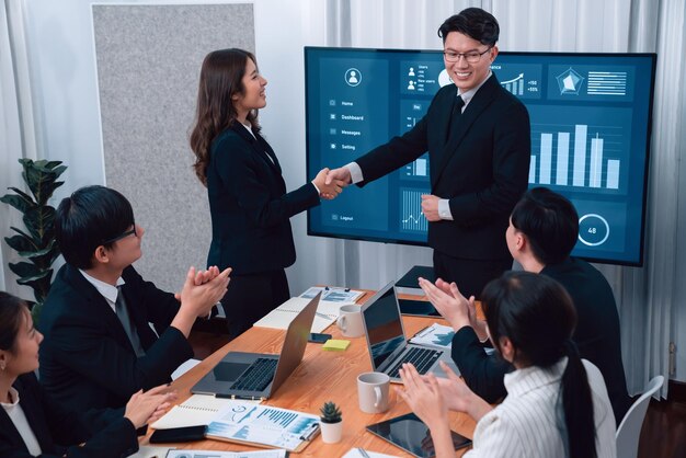 Photo employees shake hand for symbol of harmony after successful business meeting