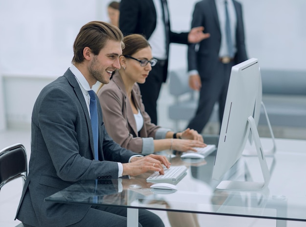 Employees sitting at a Desk in the Bank officephoto with text space