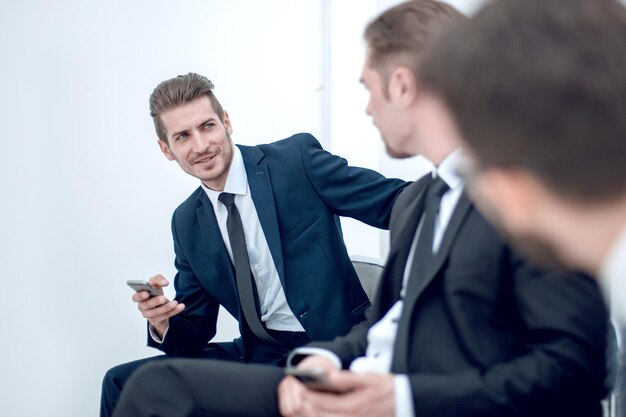 Employees sitting in the office hallway