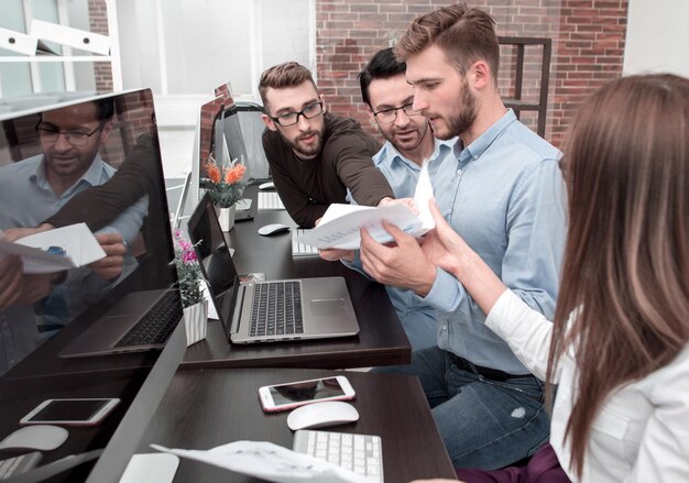 Employees use computers to work with business documents