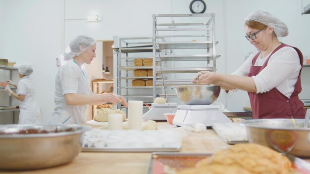 The employees women of the bakery work, wide view