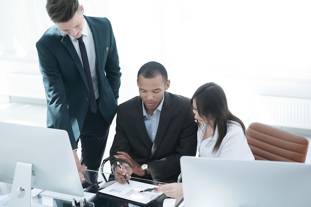 Employees working with financial documents in the office.office life