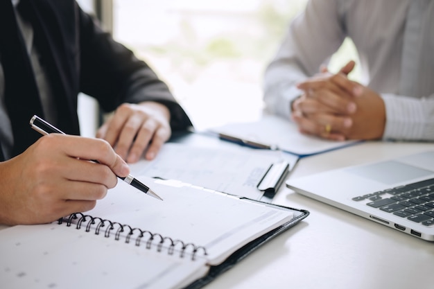 Employer arriving for a job interview, businessman listen to candidate answers explaining about his profile and colloquy dream job, manager sitting in job Interview talking in office