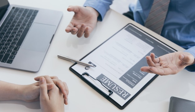Employer or selection committee is reading the candidates resume and competence background