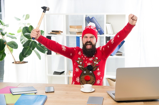 Employment rights concept days off as paid leave forced to work\
on christmas eve contractual right to not work on christmas day mad\
worker destroy laptop with hammer refuse to work on christmas