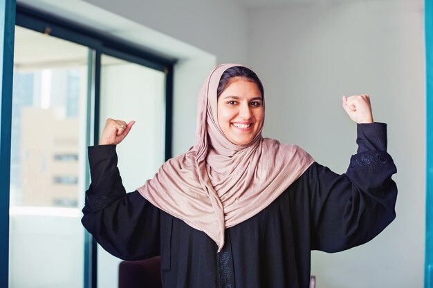 Empowered Muslim womanwearing abaya