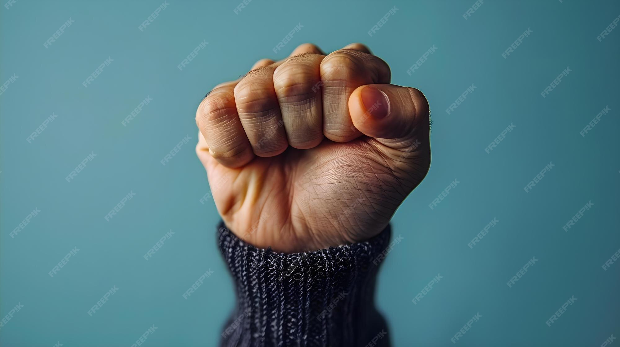 Premium Photo | Empowerment Clenched Fist Triumph and Victory Through 