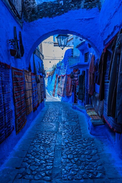 Empty alley amidst buildings in city