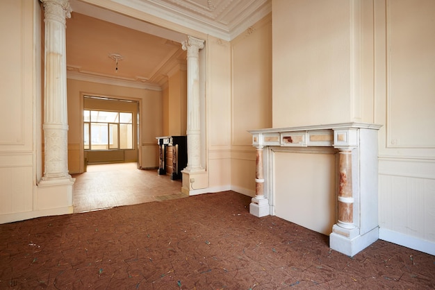 Empty apartment with two classical fireplaces in perspective and before renovation