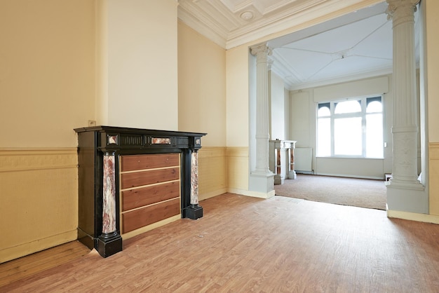 Empty apartment with two classical fireplaces in perspective and before renovation