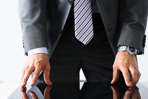 Empty arms of man in suit and tie closeup