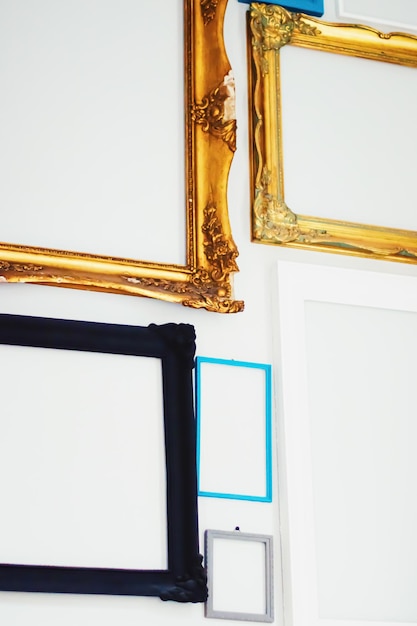 Empty art frames on gallery wall decor and design