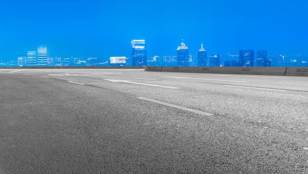 Empty asphalt road and city skyline and building landscape, China.
