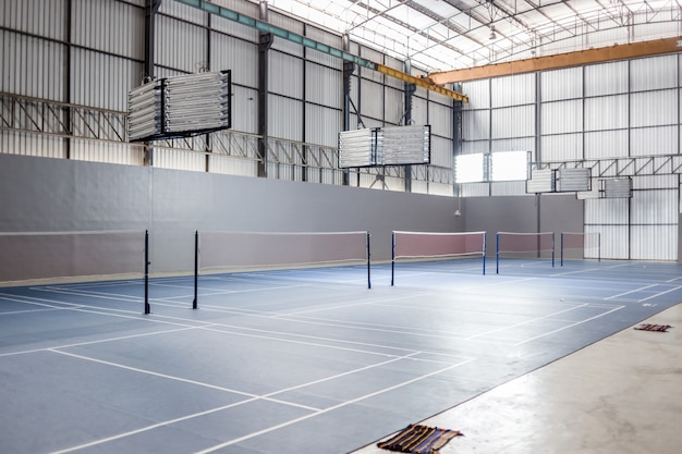 Empty badminton court with spot light