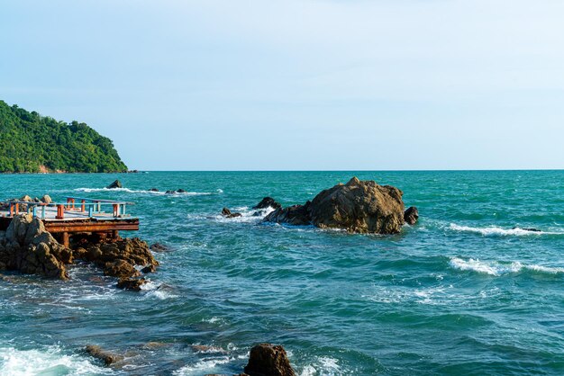 Empty balcony and wooden bench with coast and sea background at Chedi Klang Nam in Chanthaburi Thailand