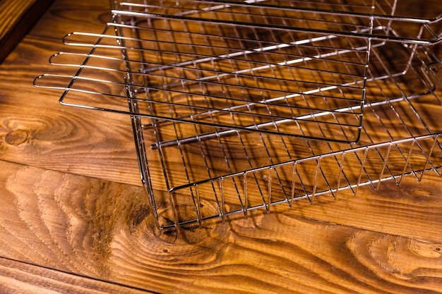 Empty barbecue grill on a wooden table